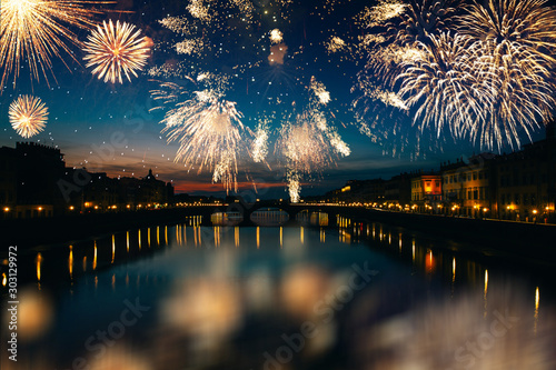 Long exposure night photography of the Ponte Vecchio, Florence-Italy and fireworks.  photo