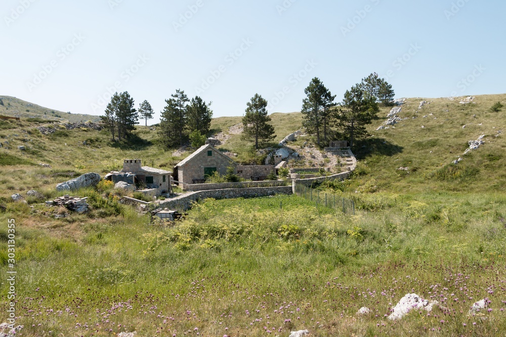 A lone house on a mountainside A lone house on a mountainside