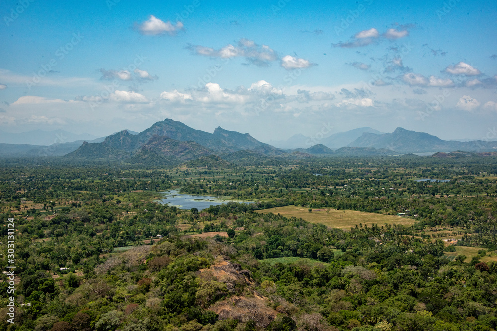 vista of  mountains, lakes and jungle  from the top if the Lion Rock
