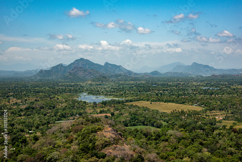 vista of  mountains  lakes and jungle  from the top if the Lion Rock