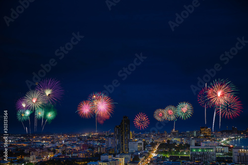 Firework above night city in new year and Cristmas eve celebration, 2020 templace copy space