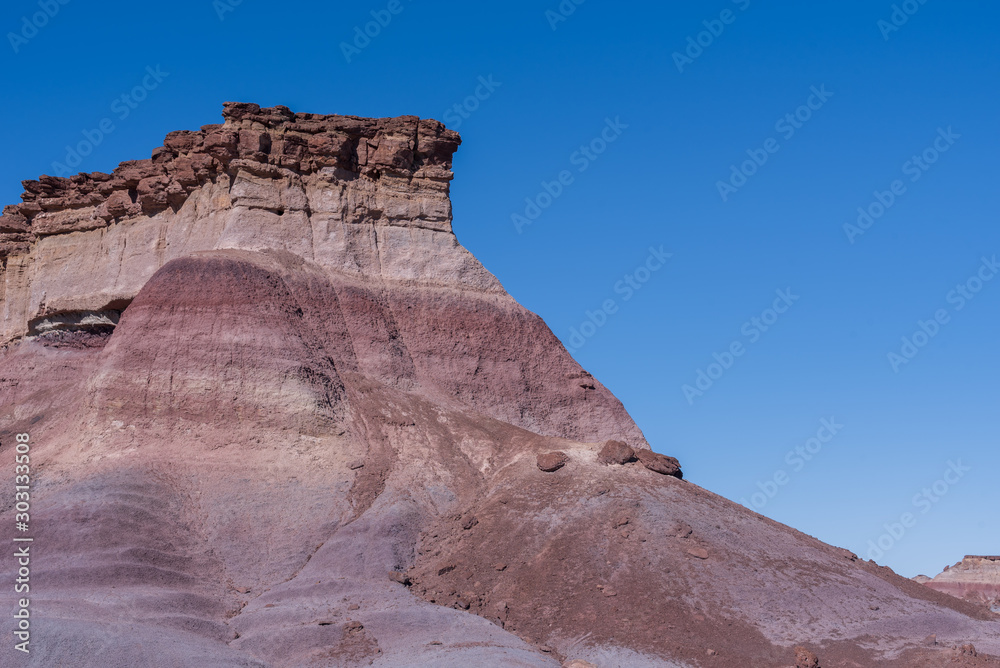 Landscape of purple striped badlands hill in Arizona