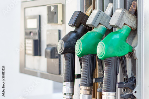 gas pump nozzles in station