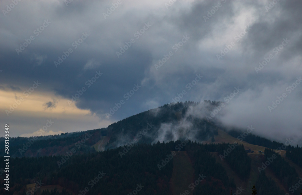 Autumn landscape background in the rain weather with fog