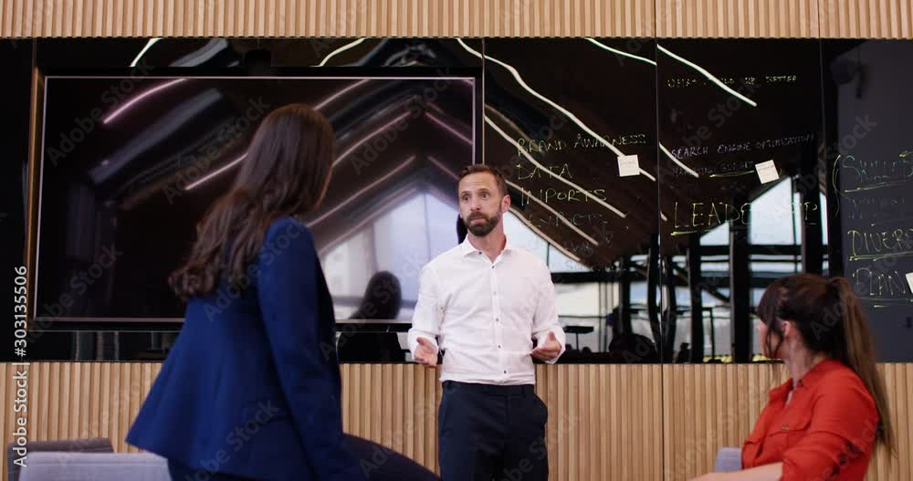 4K Young professionals discussing ideas in a brainstorming meeting. Slow motion. 4K Young professionals discussing ideas in a brainstorming meeting. Slow motion.