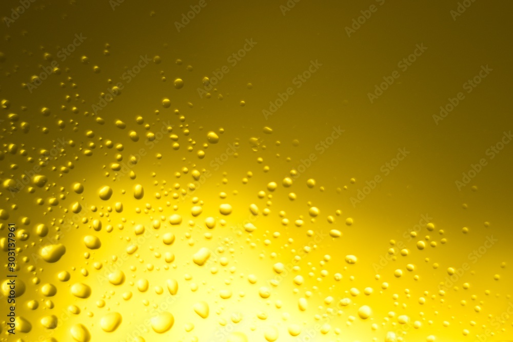 Yellow oil bubbles on water, cooking oil background. Yellow oil bubbles on water, cooking oil background.
