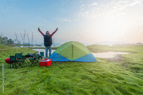 Asian people come to camping and take pictures in the morning. Sun rise Asian river belt