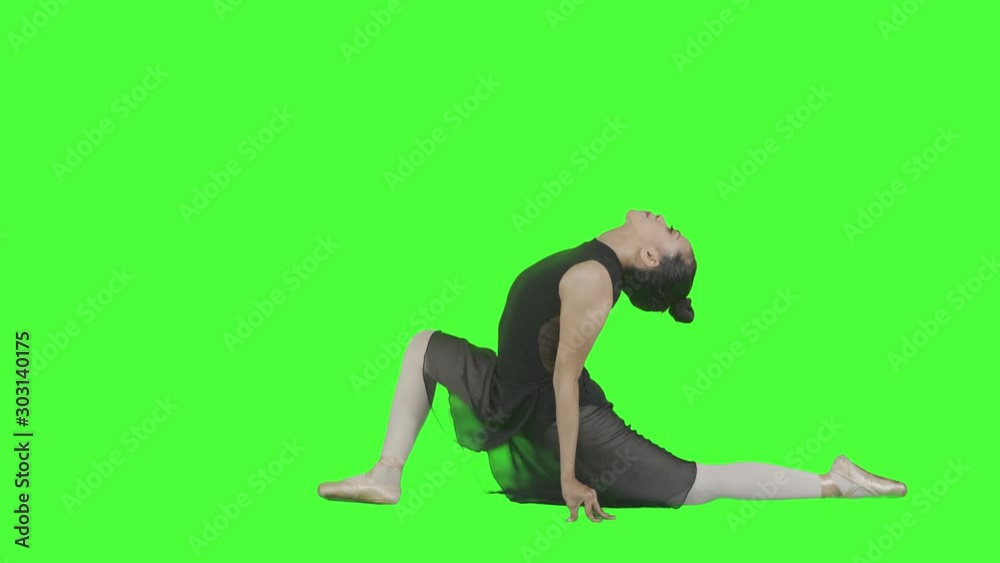 Attractive ballet dancer doing warm up her body before dancing exercise in the studio. Shot in 4k resolution with green screen background Attractive ballet dancer doing warm up her body before dancing exercise in the studio. Shot in 4k resolution with green screen background