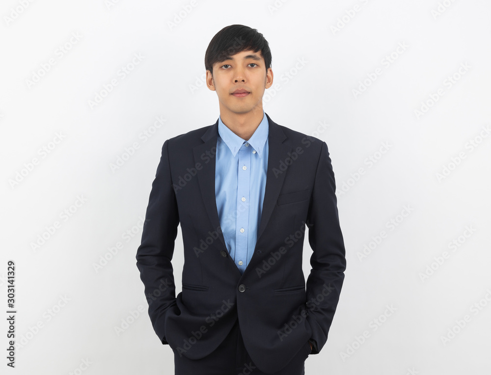 Young handsome asian business man looking to camera isolated on white background. Young handsome asian business man looking to camera isolated on white background.
