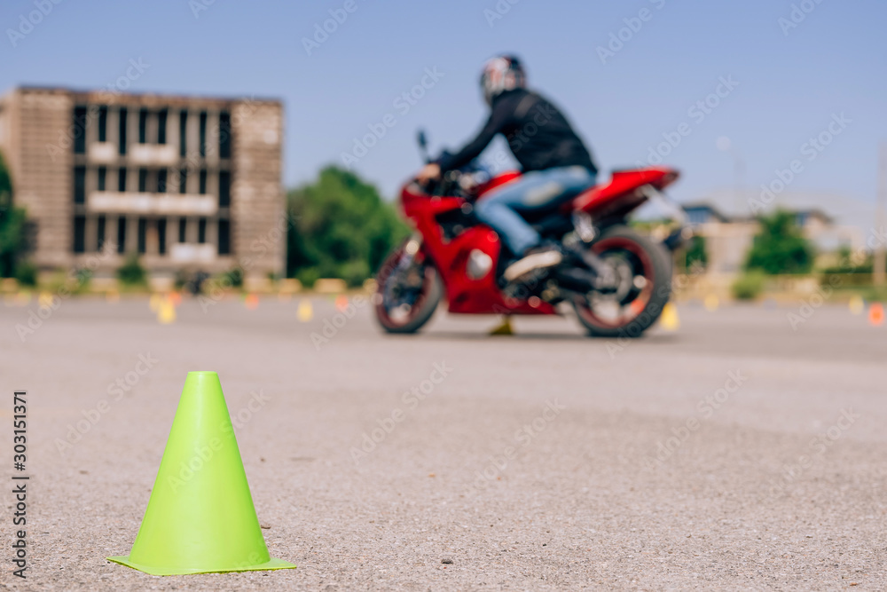 Green cone close-up on the site for bikers. Traffic cones on the ...