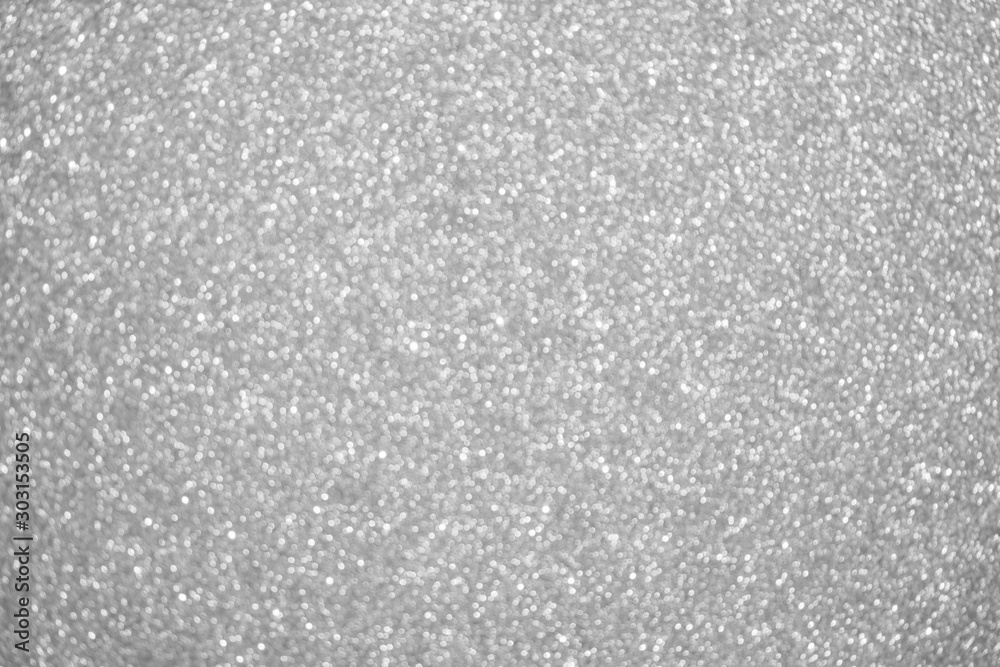 Abstract silver glitter sparkle defocused light background