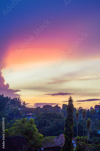 Dramatic sky sunrise in Ubud, Bali, Indonesia. Vivid colors scenery. © Iuliia