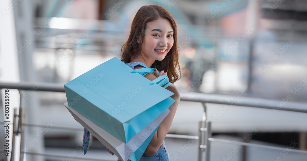 Happy young woman shopping in the mall with enjoying. Happy young woman shopping in the mall with enjoying.