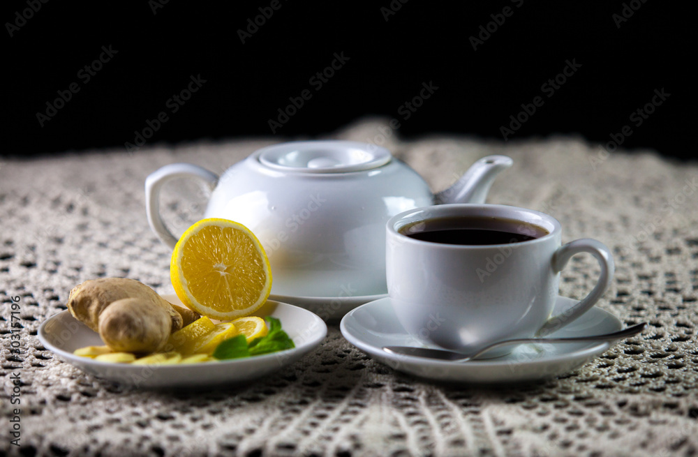 cup of tea with lemon and teapot cup of tea with lemon and teapot