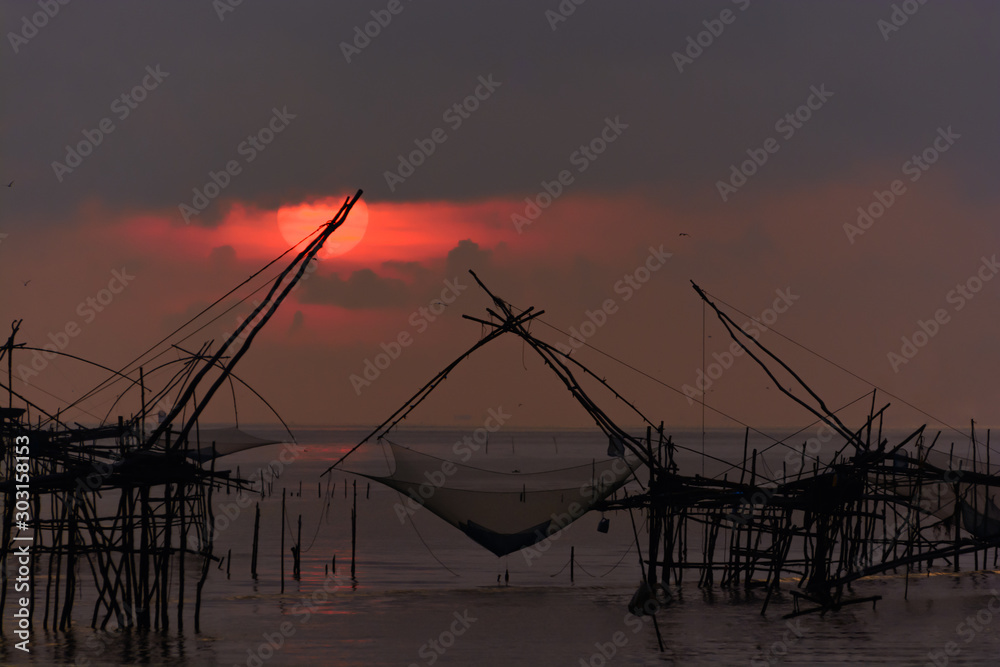 sunrise fishing trap in Pak Pra Talay Noi sea Phatthalung south of Thailand
