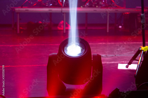Obraz na plátně spotlight emitting white light on a concert stage