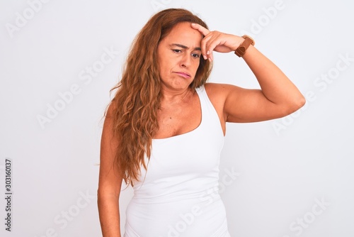 Middle age mature woman standing over white isolated background worried and stressed about a problem with hand on forehead  nervous and anxious for crisis