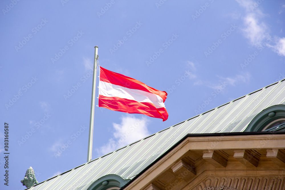 Austrian flag in wind on rooftop