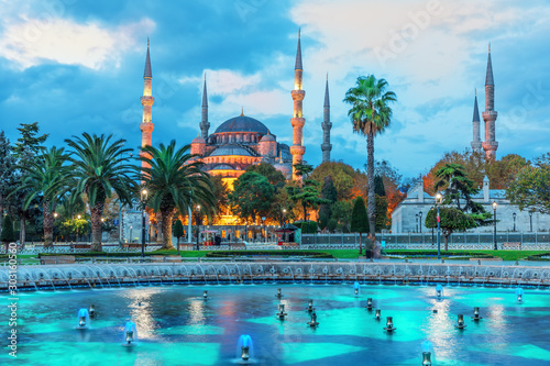 The Sultan Ahmet Mosque and the fountain in the blue shadows of sunrise, Istanbul