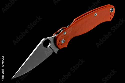 Knife With Orange Handle Isolated on Black Background Close-up