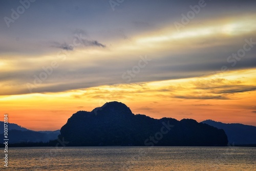 Islands Sunset, Ocean panorama views near Phuket with deep Red, Orange, Purple and Blue, mountains, twilight in Thailand. Including Phi Phi, Ko Rang Yai, Ko Li Pe and other islands. Asia. © Jeremy