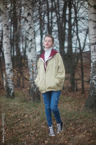  beautiful young blonde walking in autumn forest