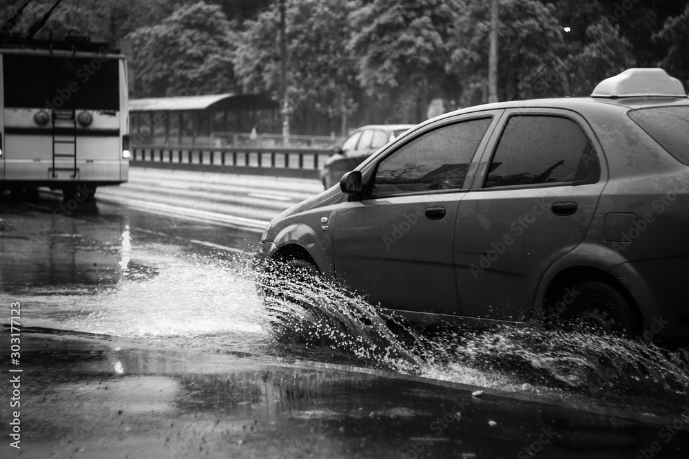 Ukraine. Kiev - 05,12,2019 Spraying water from the wheels of a vehicle ...