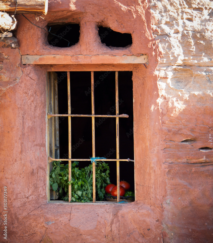 Traditional Jordanian Bedouin window with vegetables ripening