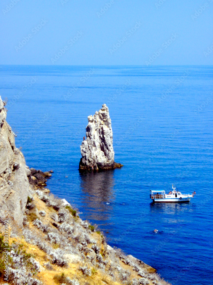 ukranian black sea coast with ship and rock