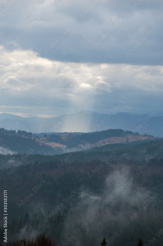 Autumn landscape background in the rain weather with fog