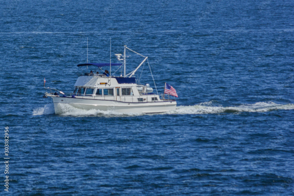 Fishing boat plowing through water on Puget Sound Fishing boat plowing through water on Puget Sound