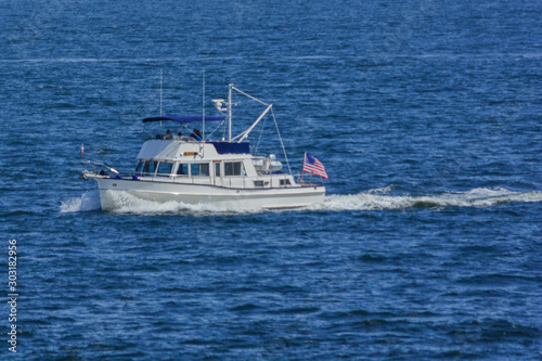 Fishing boat plowing through water on Puget Sound
