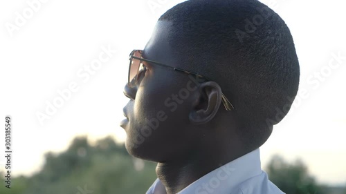 Young american afrcan man contemplating sunset.Ideas, hopes,future. photo