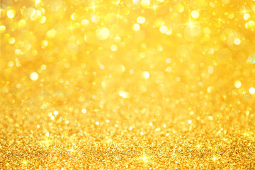 Luxury gold glitter with bokeh background, de-focused.