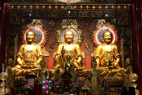 Three beautiful golden Buddha statue in Chinese temple, Thailand