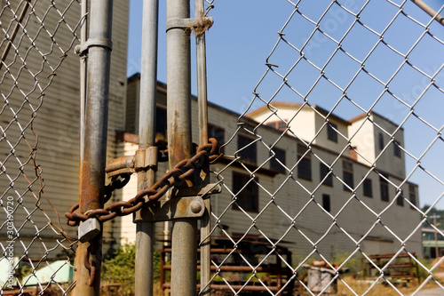 Old abandoned fenced off industrial factory