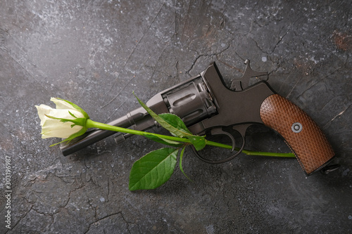 Wallpaper Mural Revolver and white rose on a dark background. Torontodigital.ca