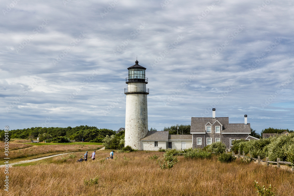 Highland Lighthouse, Cape Cod National Seashore, North Truro, Massachusetts with golfers in foreground. 