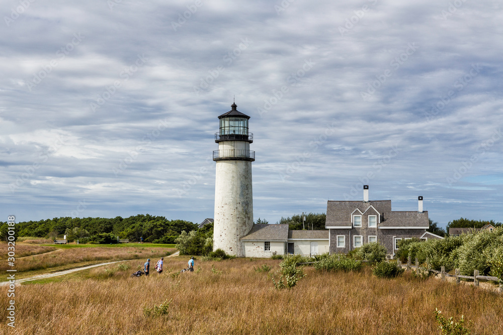 Highland Lighthouse, Cape Cod National Seashore, North Truro, Massachusetts with golfers in foreground. Highland Lighthouse, Cape Cod National Seashore, North Truro, Massachusetts with golfers in foreground.