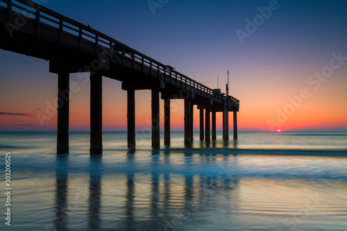 Fotografie Sunrise at St. John's Pier, St. Augustine, Florida.