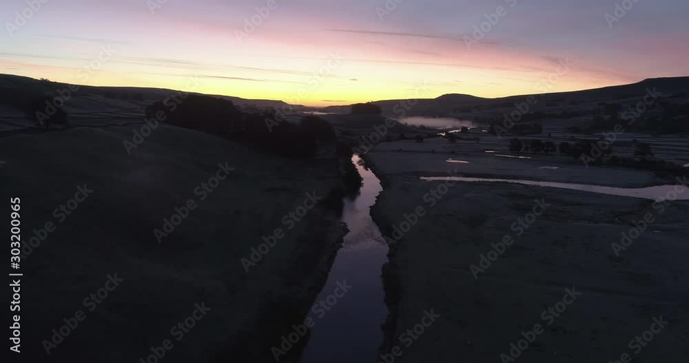 Aerial shot of colorful sunrise in the tranquil valley. Aerial shot of colorful sunrise in the tranquil valley.