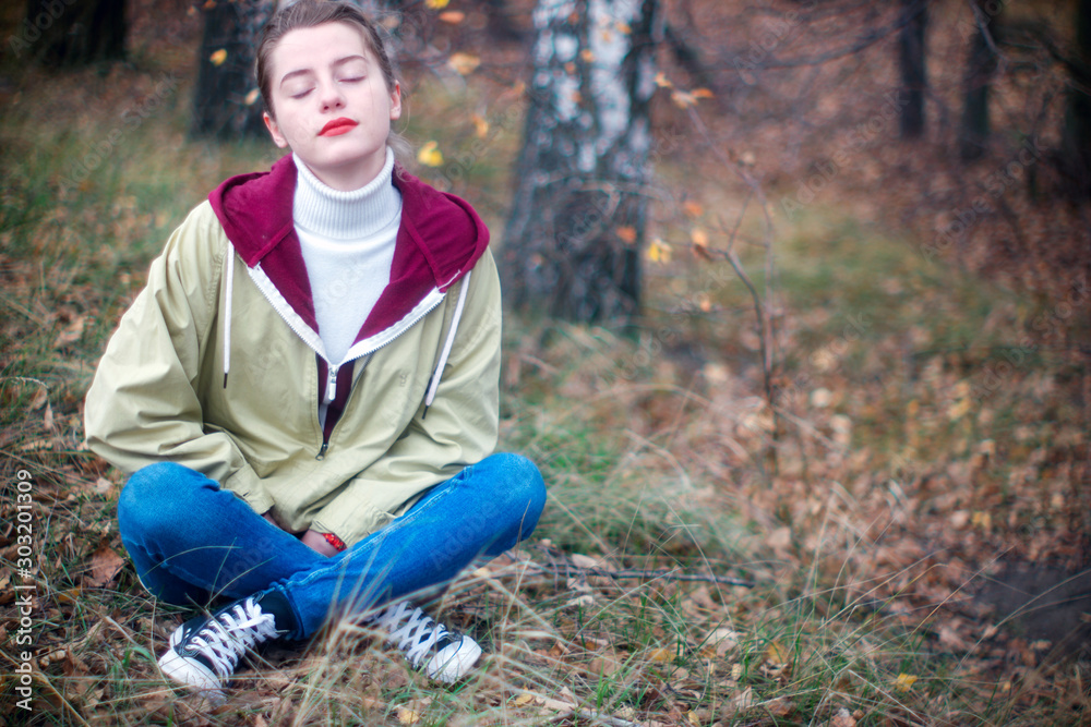 beautiful young blonde on a blurry background of autumn beautiful young blonde on a blurry background of autumn