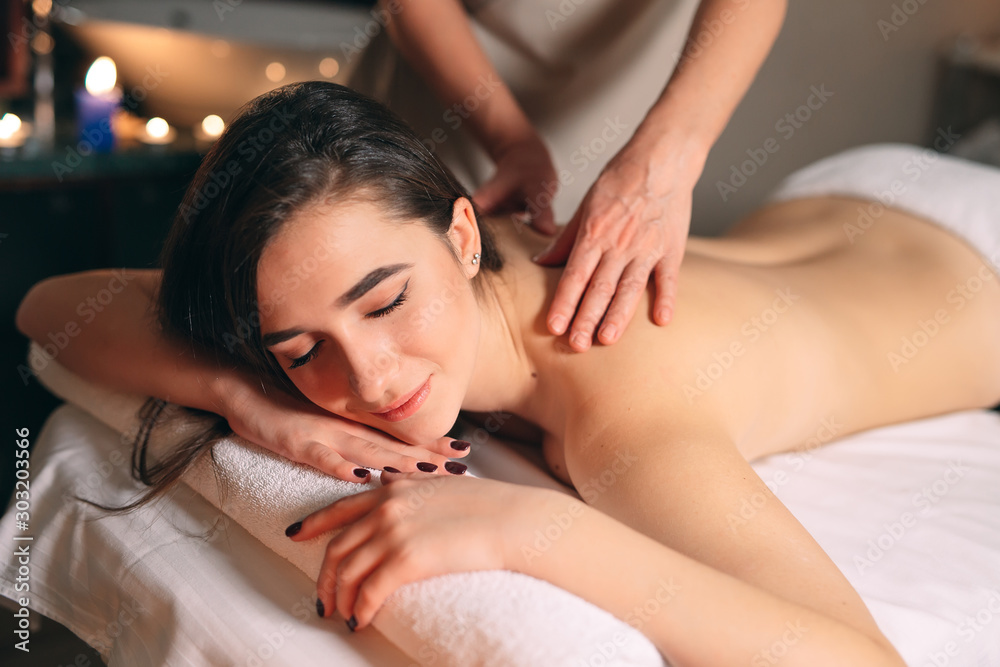 Spa, massage. Young dark-haired beautiful girl doing massage. Spa, massage. Young dark-haired beautiful girl doing massage.