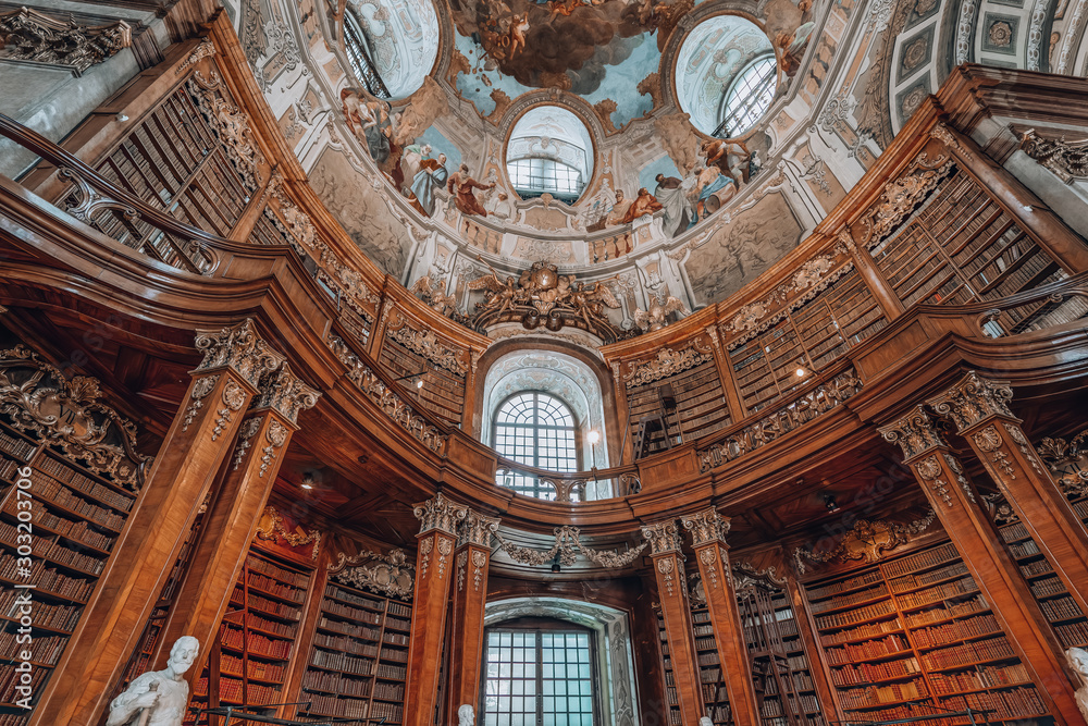 Books on the bookshelf at Prunksaal inside imperial national library i Vienna, Austria - obrazy, fototapety, plakaty 