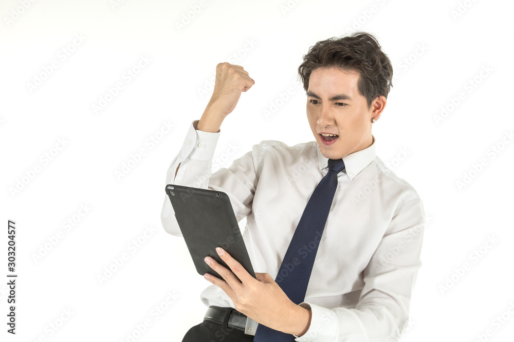 Portrait of smart young asian businessman wearing white shirt holding computer tablet feelings glad and raised fist on isolated white background and copy space. Portrait of smart young asian businessman wearing white shirt holding computer tablet feelings glad and raised fist on isolated white background and copy space.