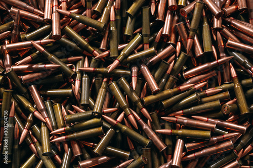 Different ammo on wooden background.