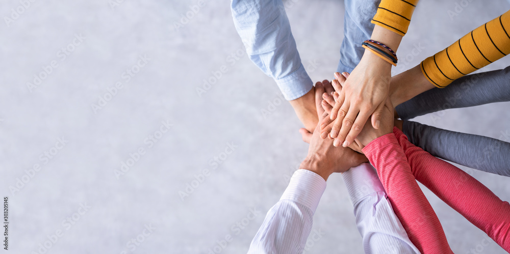 Stack of hands. Unity and teamwork concept. - obrazy, fototapety, plakaty 