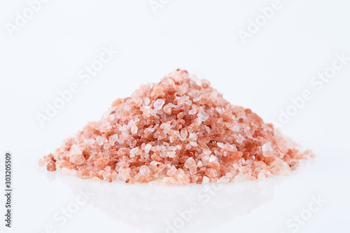 Pink himalayan salt isolated on white background. photo