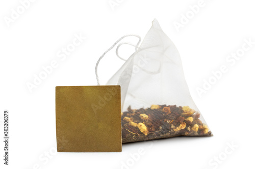 Tea bag with blank label on white.