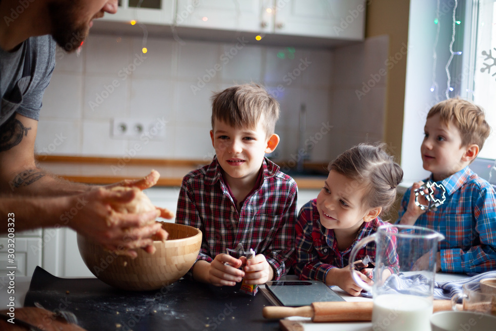 Young family making cookies at home Young family making cookies at home